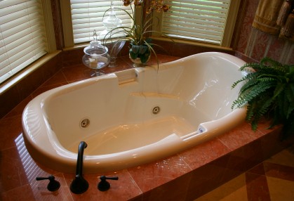 Bathtub plumbing by Overland Plumbing.